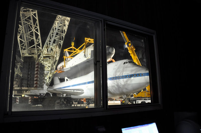 Space shuttle Enterprise hoisted off jumbo jet in New York